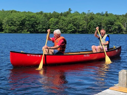 Dr. Branton and his son canoeing