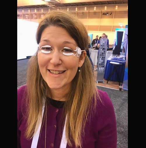 Dr. Pamela Theriot trying out new dry eye technology at the SECO educational conference