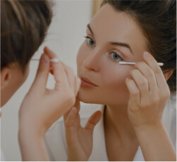 woman apply Lid Cleansing at Lusk Eye Specialists