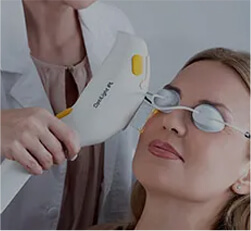 woman taking OptiLight at Lusk Eye Specialists