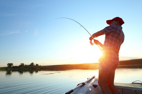 man caught a fish on river